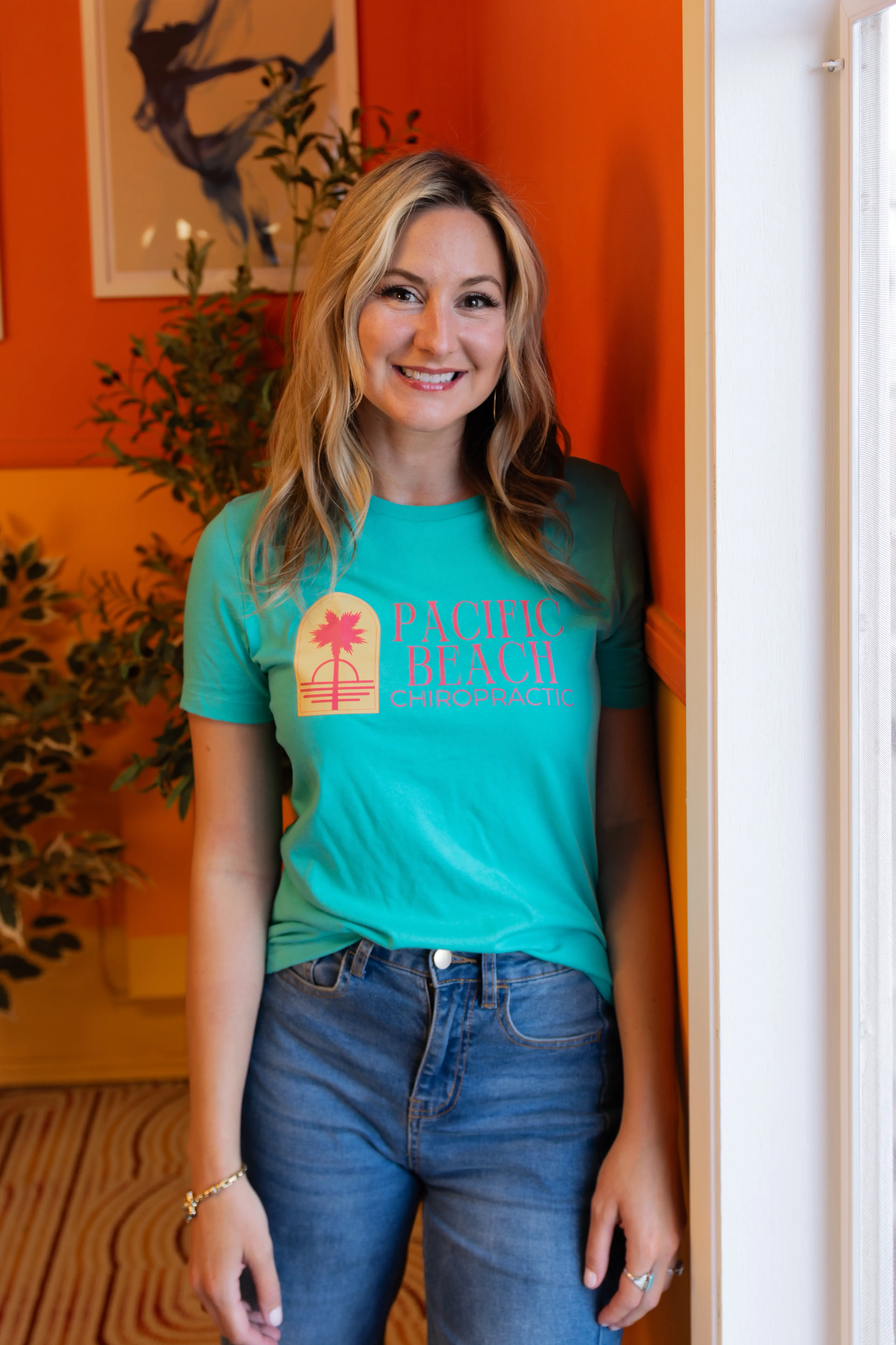 Dr Allison Champagne standing and smiling